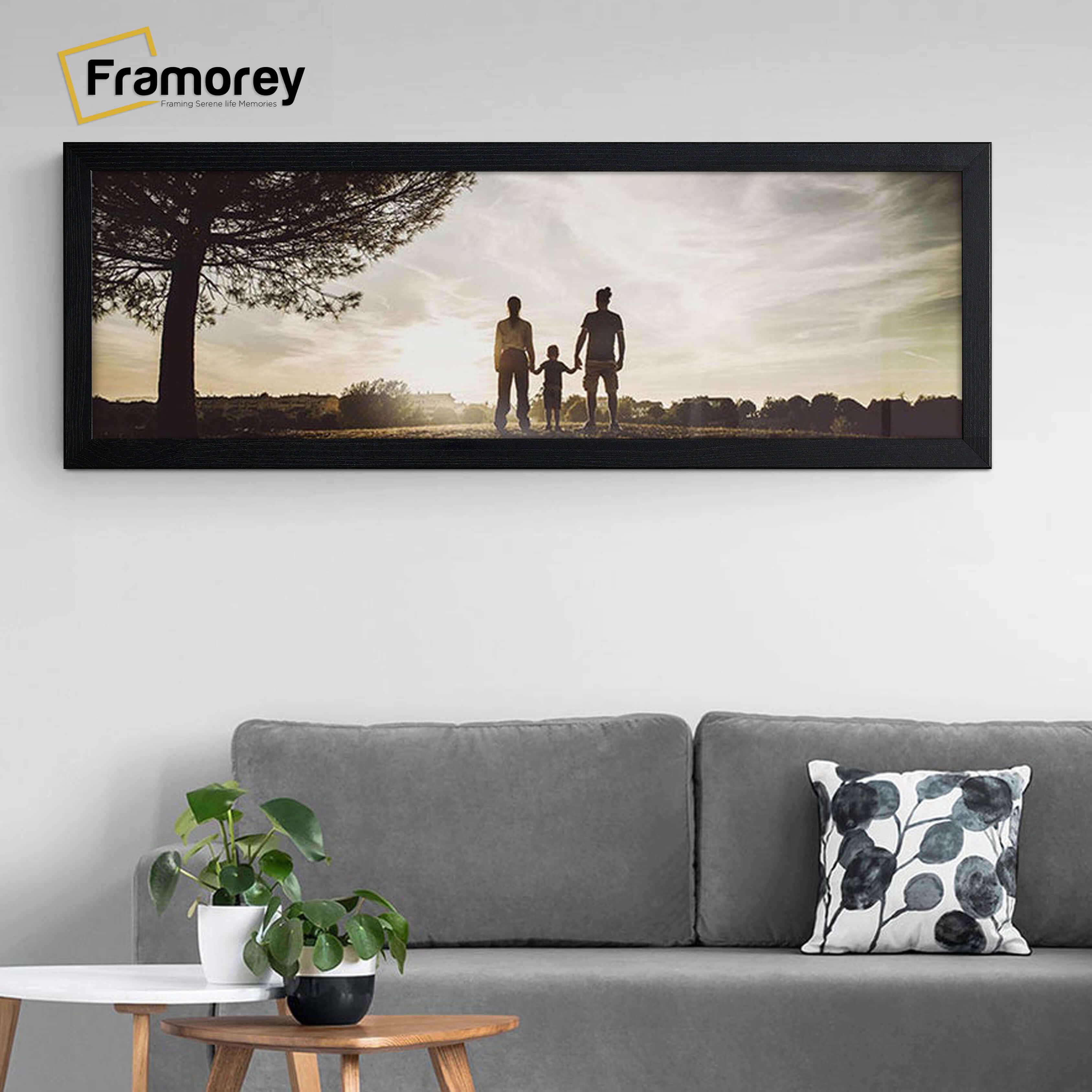 Flat Wooden Panoramic Size Ash Black Poster Frame Wall Art Photo Frame hanging on a wall.