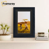 Black Picture Frame Photo Frame Rockstar With Black Mount on a wooden shelf with some decoration on its sides.