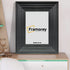 Black picture frame shown from front view on a table standing with a wall