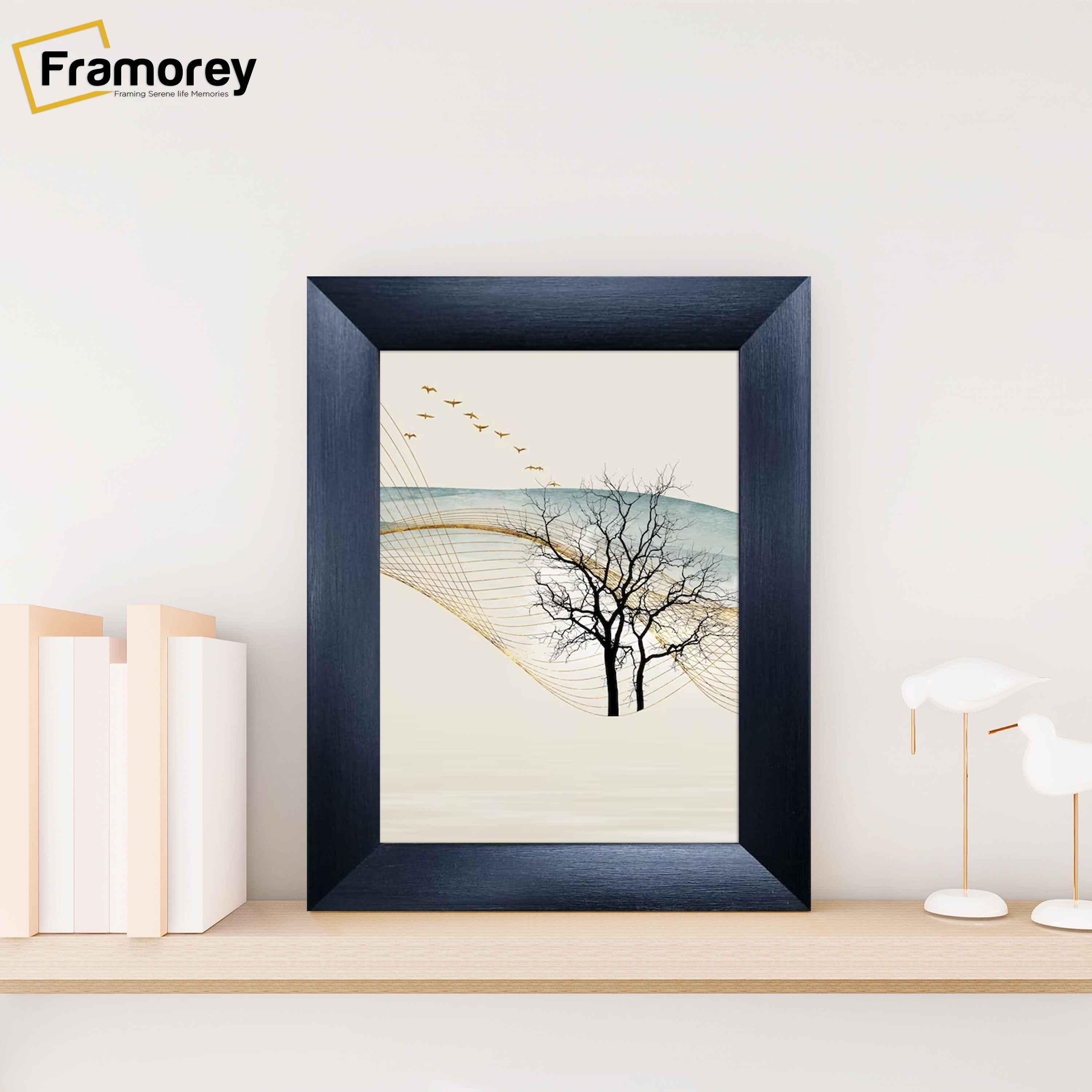 Black Picture Frame Poster Frame is placed on wooden shelf