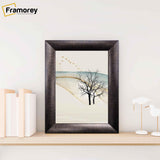 Brushed Gold Picture Frame Placed on Wooden Shelf