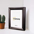 Side view of Gold With White Mount Poster frame placed on white surface