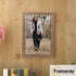 Copper picture frame hanged on a wooden wall.
