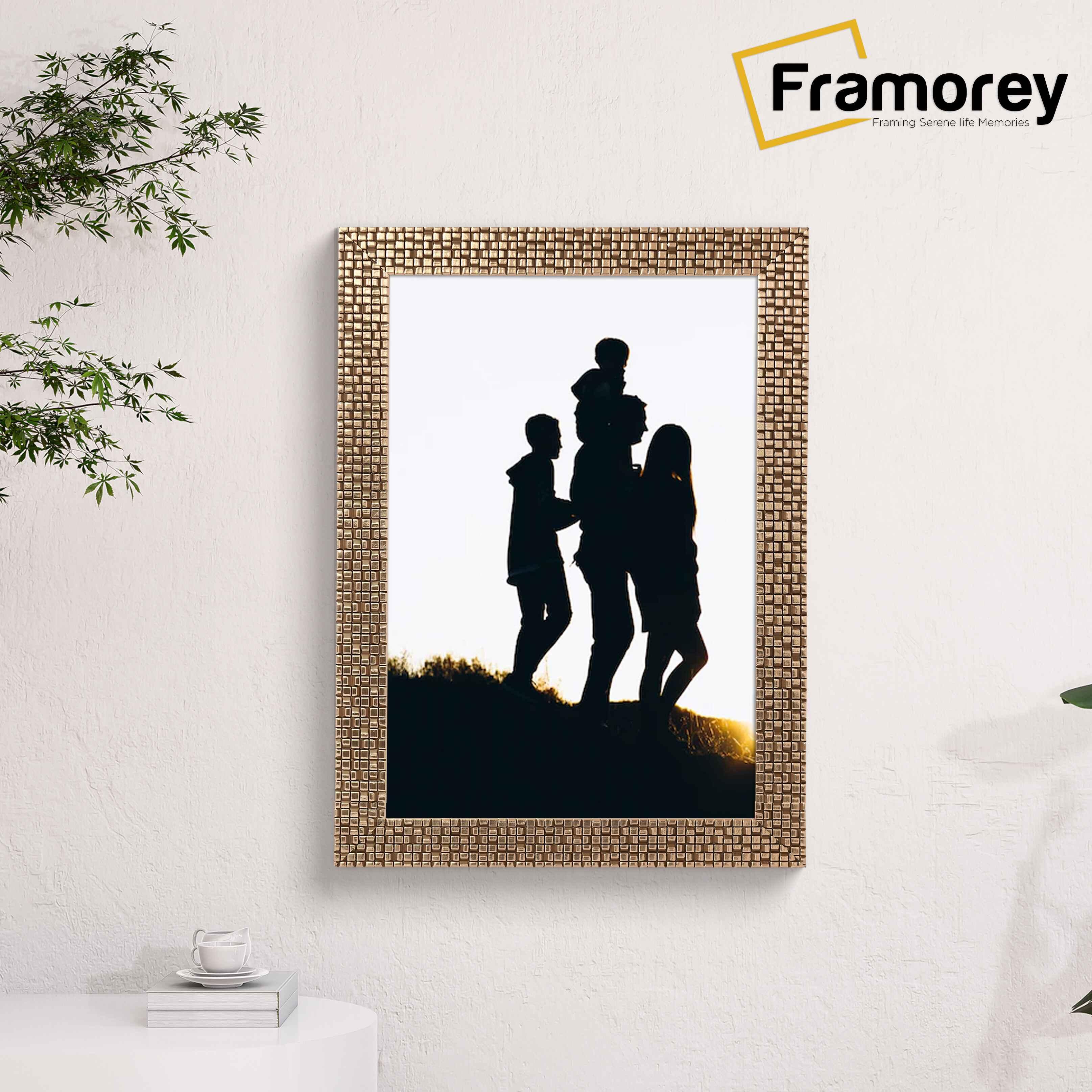 Copper picture frame hanged on a wall.