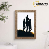 Copper picture frame hanged on a wall.