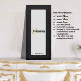Flat Panoramic Black Picture frame with white mount placed on a drawer.