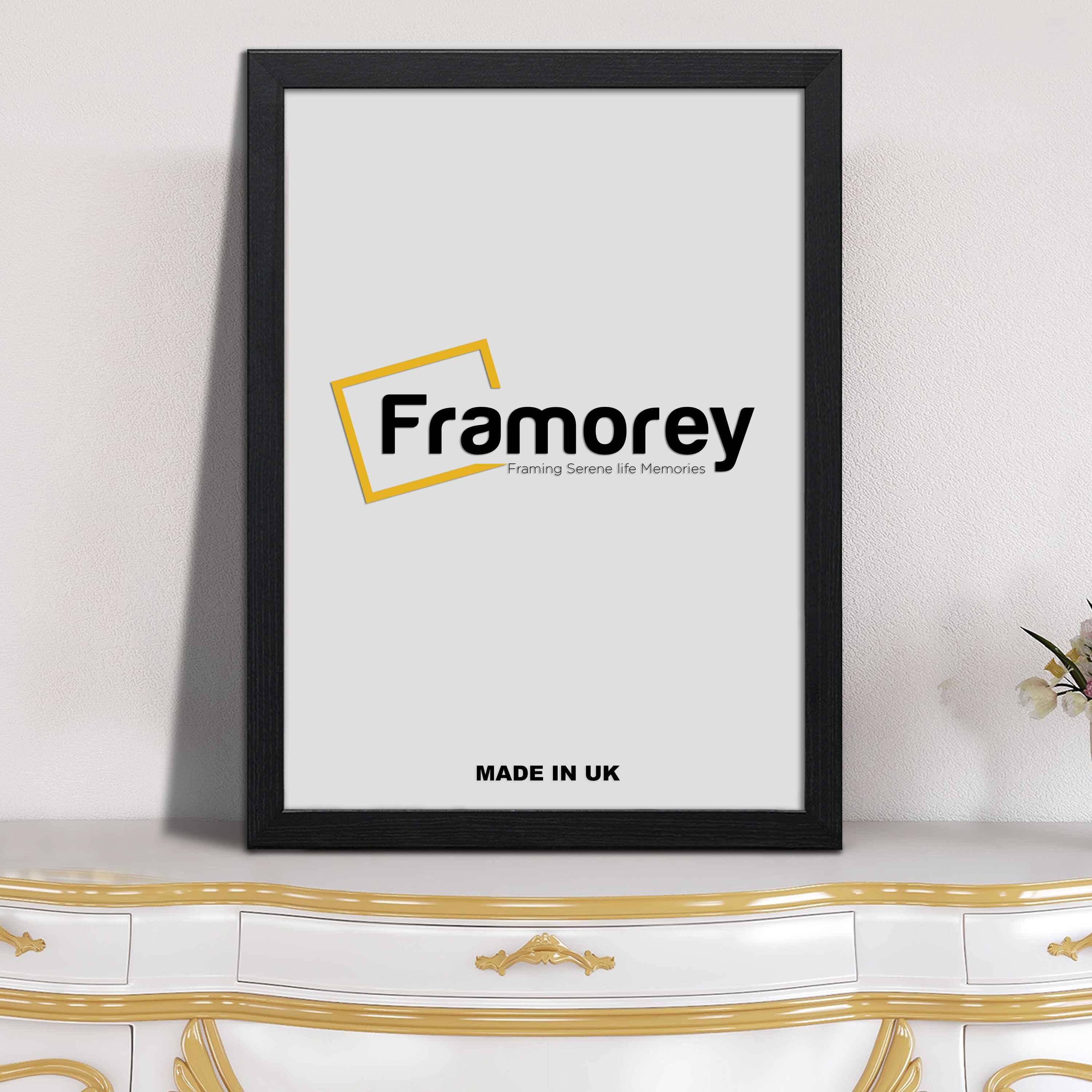 Flat black photo print frame placed on wooden table