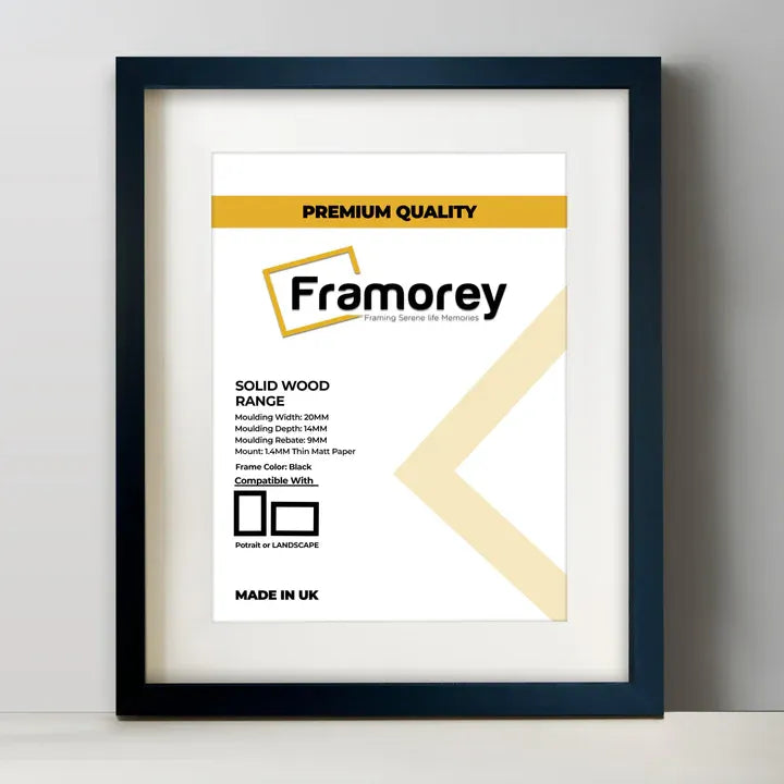 Thin Matt Black Solid Wood Picture Frame With White Mount on a plain white surface standing with a wall