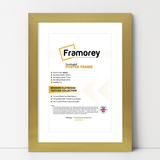 gold picture frame shown from front view on a plain white surface standing with a wall