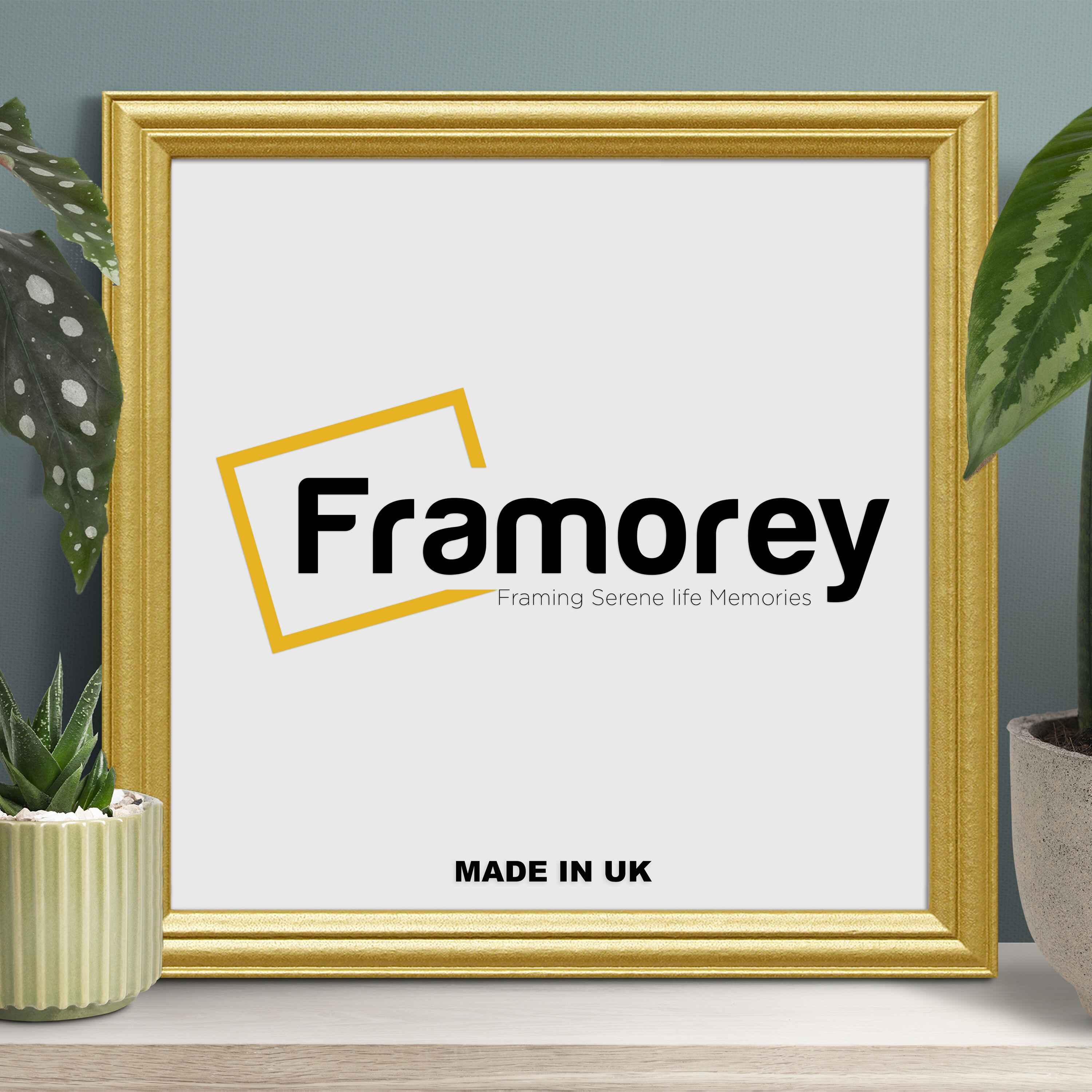 Antique Gold Photo Frame with some decorative things placed on its sides.