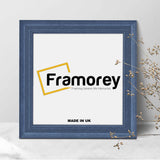 Square Grey Wooden picture frame shown from front view on a plain white surface standing with a wall