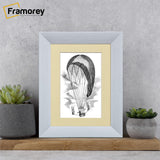 Limed White Photo Frame With Ivory Mount on a wood piece standing with the wall.