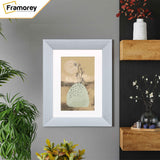 Limed White Photo Frame With White Mount hanging on a wall.