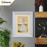 Limed White Poster Frame With Ivory Mount hanging on a wall.