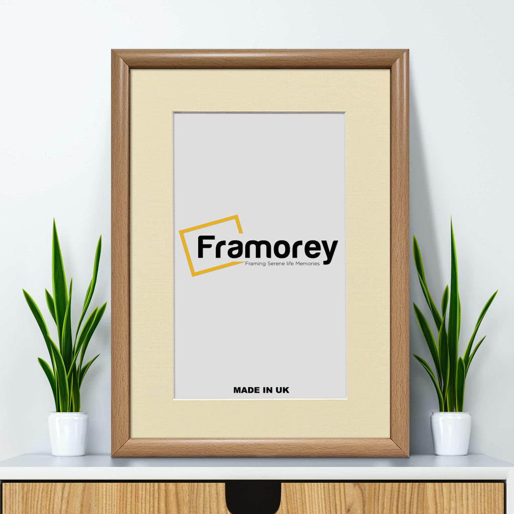 Oak Minimalist Photo Frame Wall Art Frame With Ivory Mount on a wooden drawer leaning with the wall.