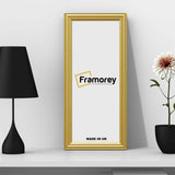Antique Style Panoramic Size Gold Picture Frame Wall Art Photo Frame on a white surface leaning with the wall.