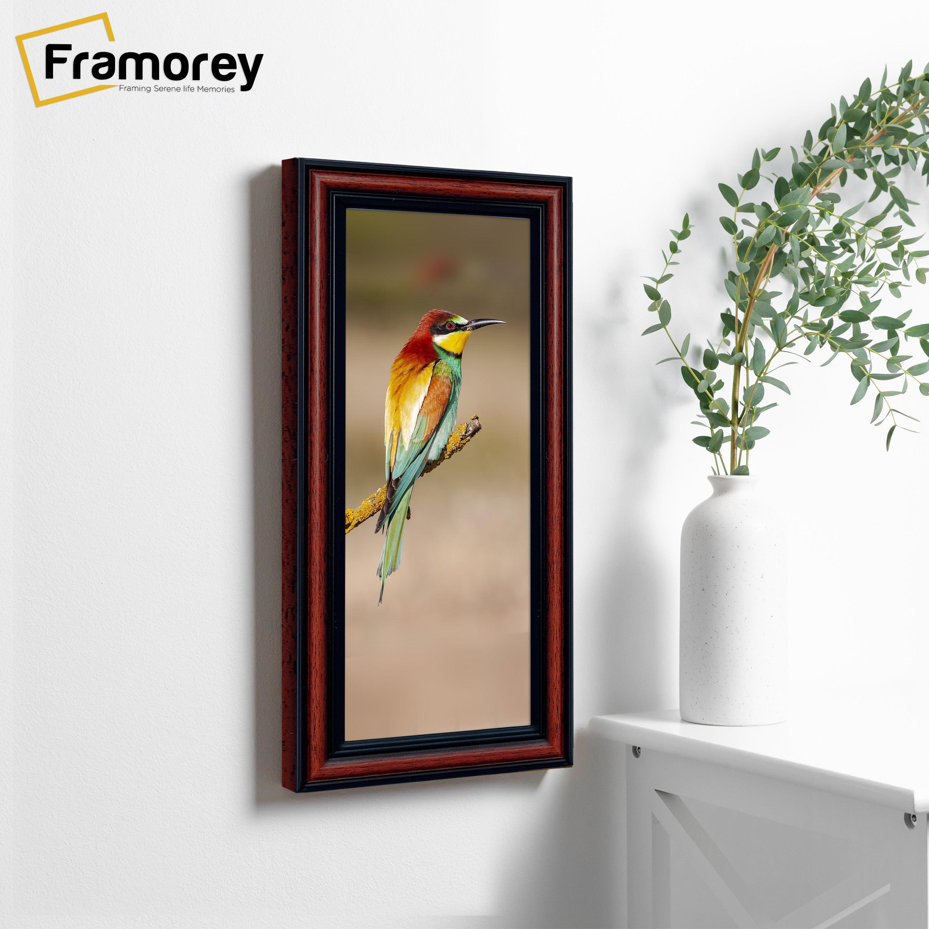 Panoramic Walnut Poster Frames  is hanging on a wall with a bird picture place inside the frame.