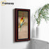 Panoramic Walnut Poster Frames  is hanging on a wall with a bird picture place inside the frame.