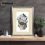 Rectangle silver poster frame with ivory mount leaning with the wall with some decorative items placed on its sides.