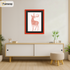 Thin Matt Red Picture Frame With Black Mount is hanging on a wall just over the Table