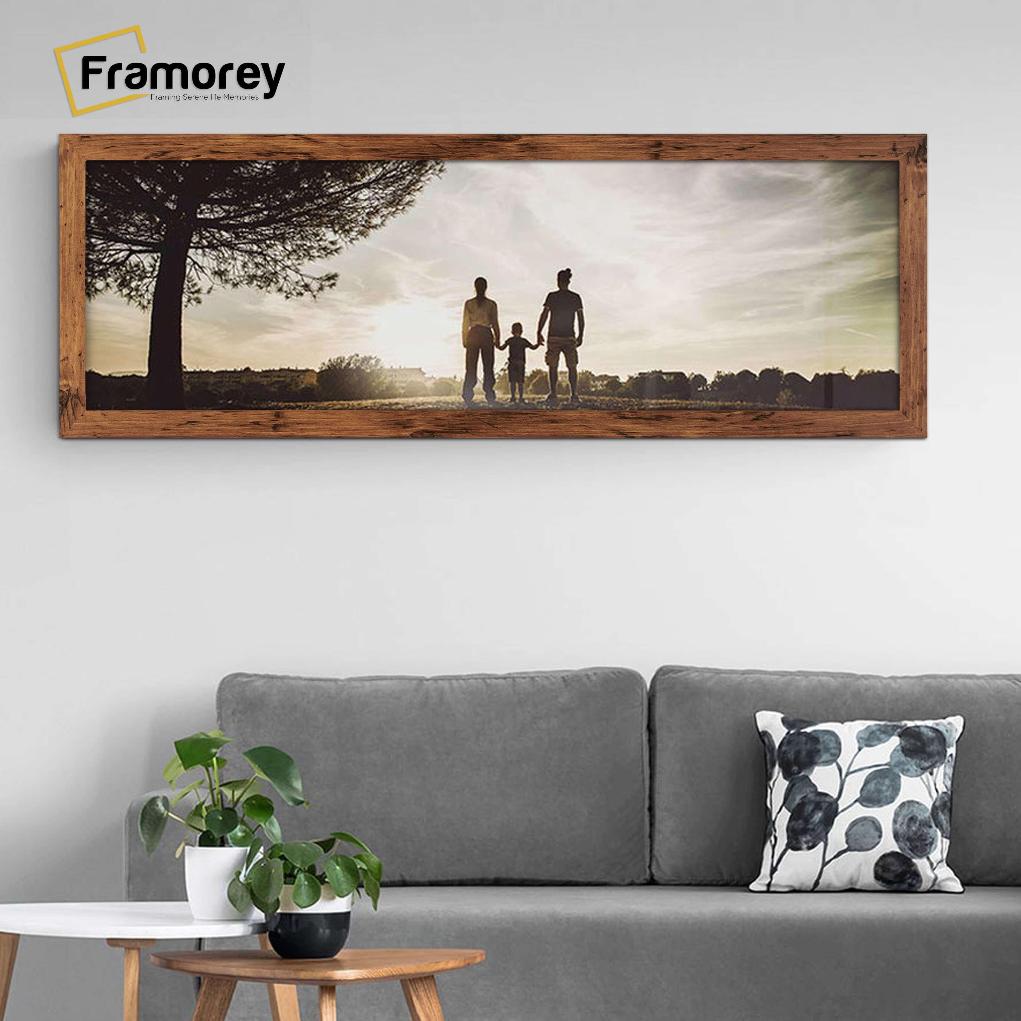 Panoramic Size Rustic Oak Picture Frame in a Landscape Direction hanging on a wall just over the couch.