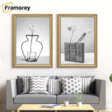 Two Gold Shabby Chic Poster Frames Hanging on a Wall Over a Couch