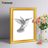 Side view of a Gold Picture Frames Handmade Wooden Effect with a bird drawing bird picture place inside it.