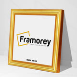 Side view of a Square Size Gold Photo Frames Photo Frames standing with the wall on a flat surface.