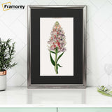 Silver Minimalist Picture Frame With Black Mount on a wooden drawer standing with the wall.