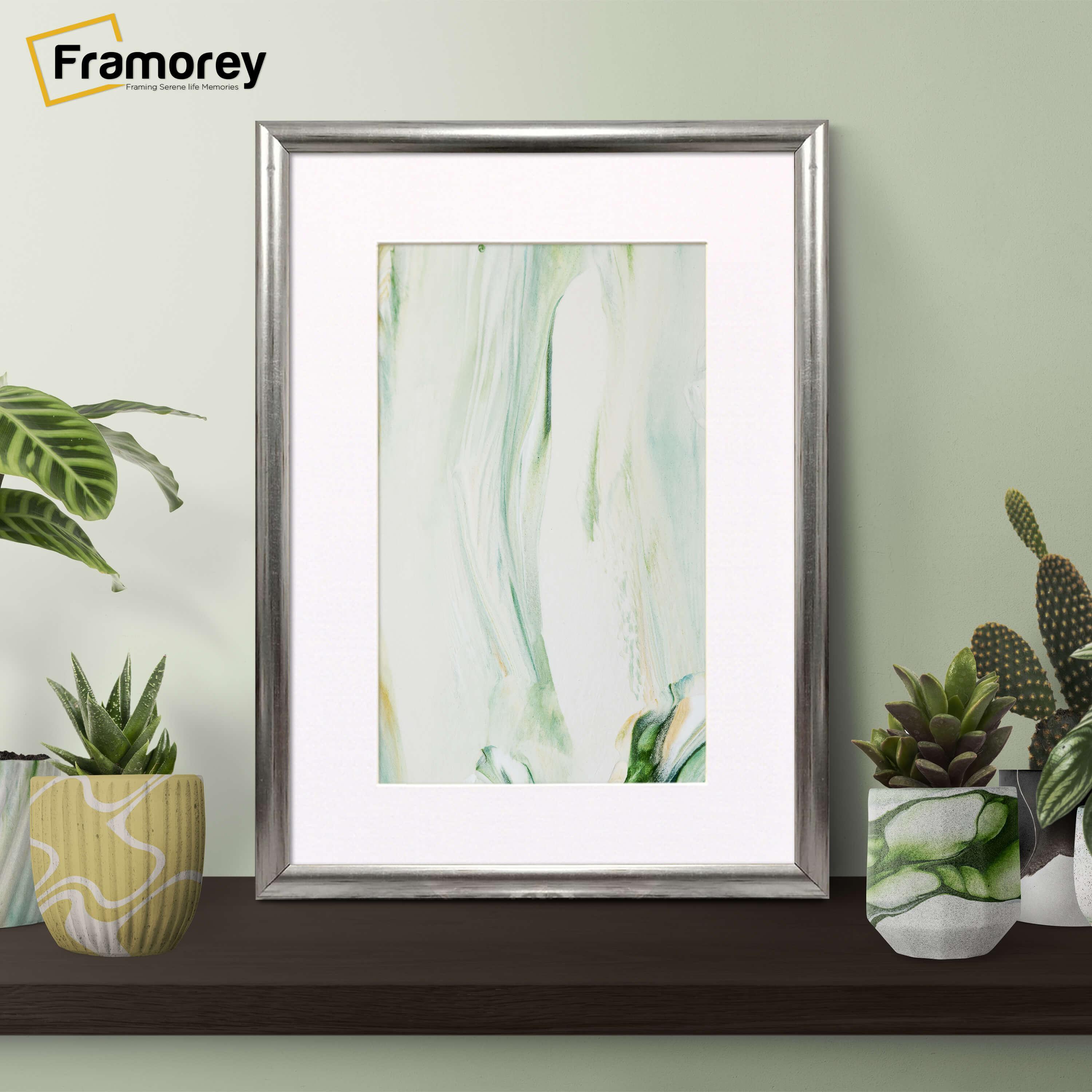 Silver Picture Frame With Mount on Table