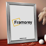 Silver Side View Picture Frame Reverse Style on a Wooden table standing with the wall.