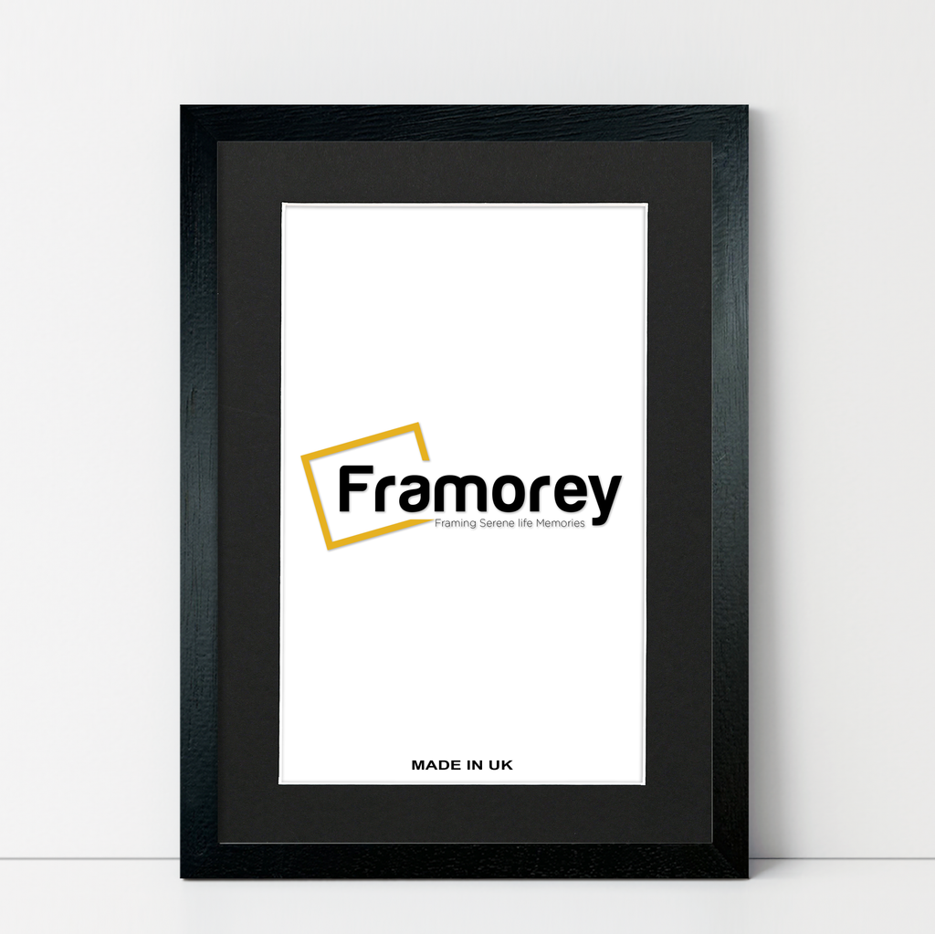 Natural Wood Black picture frame Black Mount shown from front view on a plain white surface standing with a wall