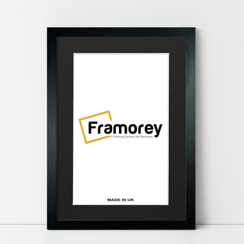 Natural Wood Black picture frame Black Mount shown from front view on a plain white surface standing with a wall