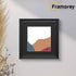 Swept Style Square Black Photo Print Frame With Black Mount hanging on a wall.