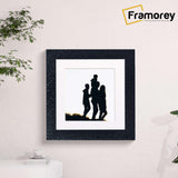 Square Black Photo Frame Rockstar Style With White Mount is hanging on a wall.