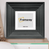 Square Black Wooden Photo Print Frame Big Step Style with White Mount Placed on a drawer.