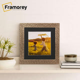 Square Photo Frame Rockstar Style With Black Mount on a wooden table standing with the wall.