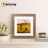 Square Picture Frame With White Mount on a wooden table standing with the wall.