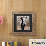 Square Photo Frame Rockstar Style With Black Mount hanging on a wooden wall.
