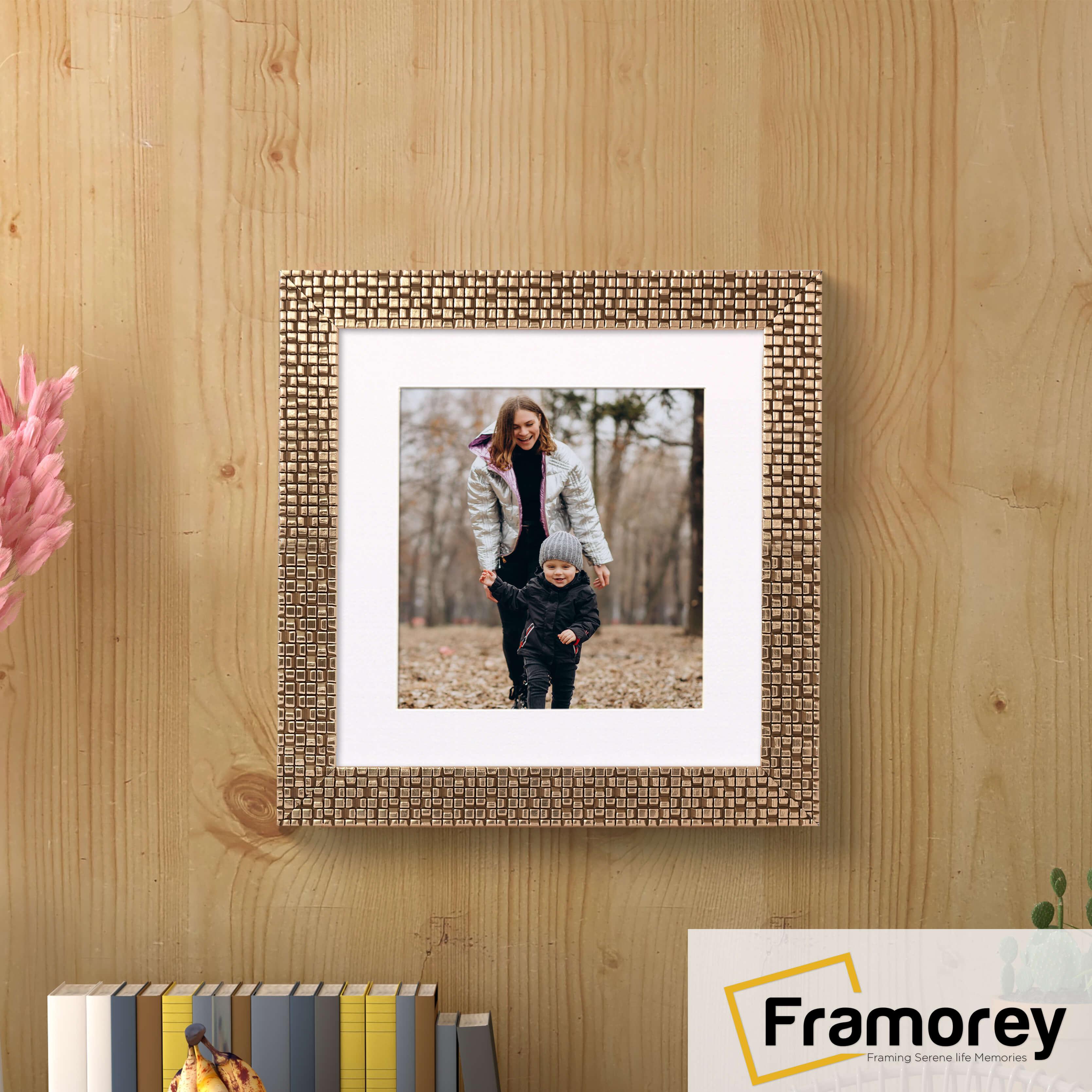 Square Picture Frame With White Mount hanging on a wooden wall.