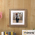 Square Picture Frame With White Mount hanging on a wooden wall.