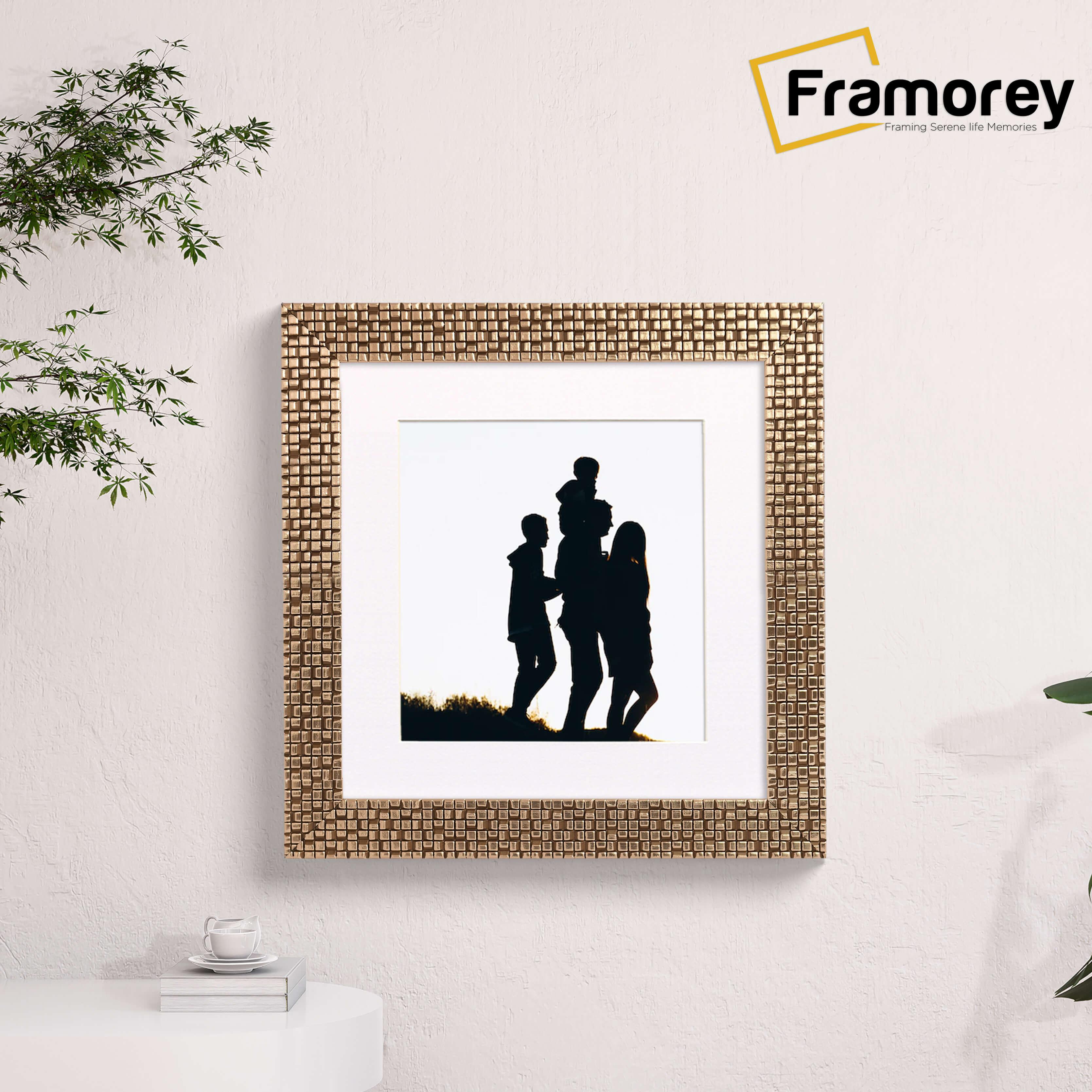 Square Picture Frame With White Mount is hanging on a wall.