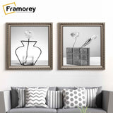 Square Gun Metal Photo Frame hanging on a wall just over the couch.