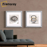 Two Square Silver With White Mount glitter Sparkle poster frames Hanged on a wall.