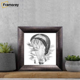 Square Size Brushed Gold Personalized Handmade Picture Frames place on a wooden slab with a drawing place inside it.