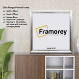 Square Size Silver Oslo Poster Frames on a wooden table standing with the wall with some detail on its measurement.