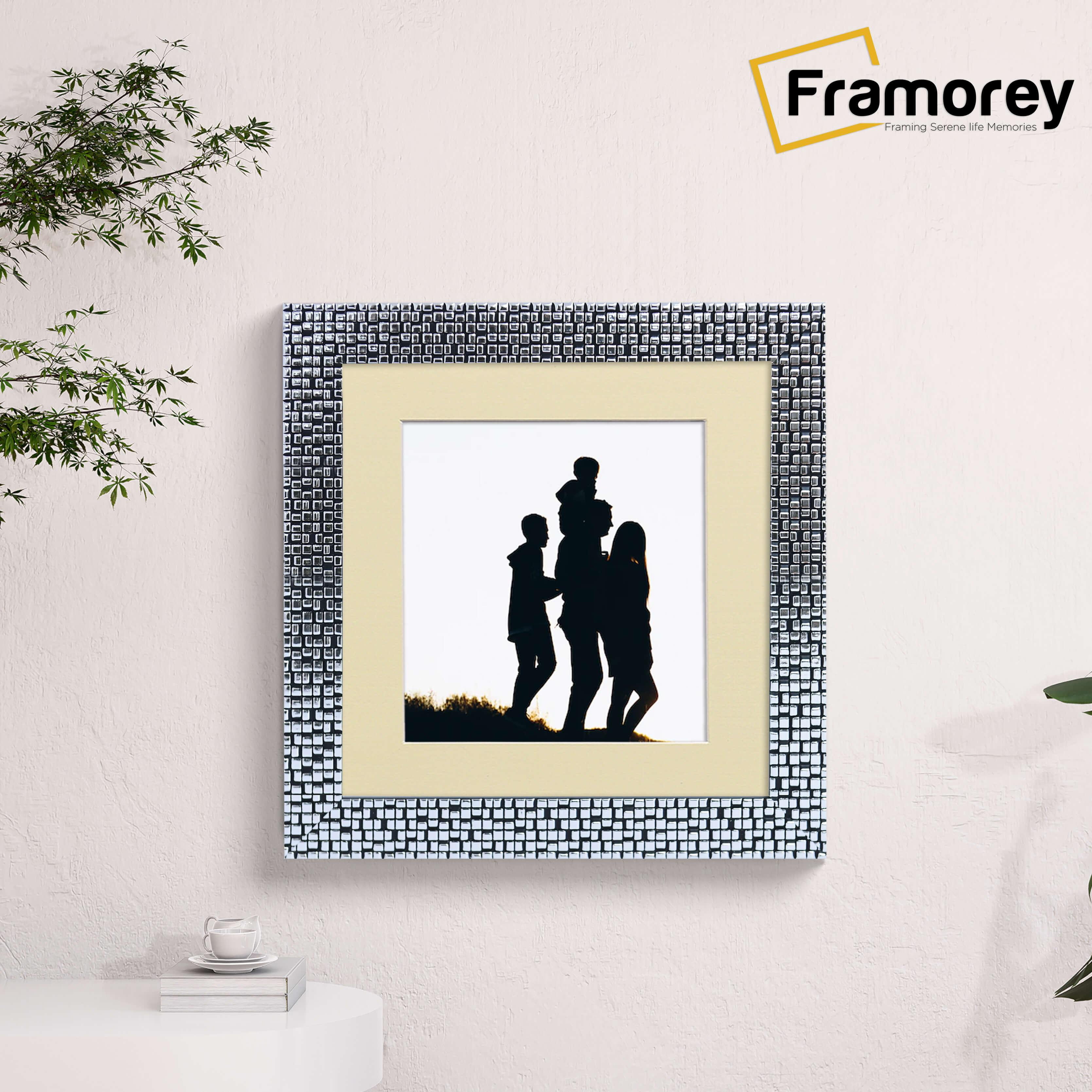 Square Size Silver Poster Frame Rockstar Style with ivory mount hanging on a wall.