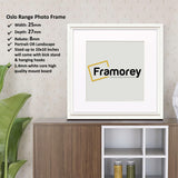 White Square Photo Frames with white mount placed on a wooden table.