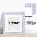 Square White Poster Frame Rockstar Style With White Mount  on a wooden surface with some details on its parts.