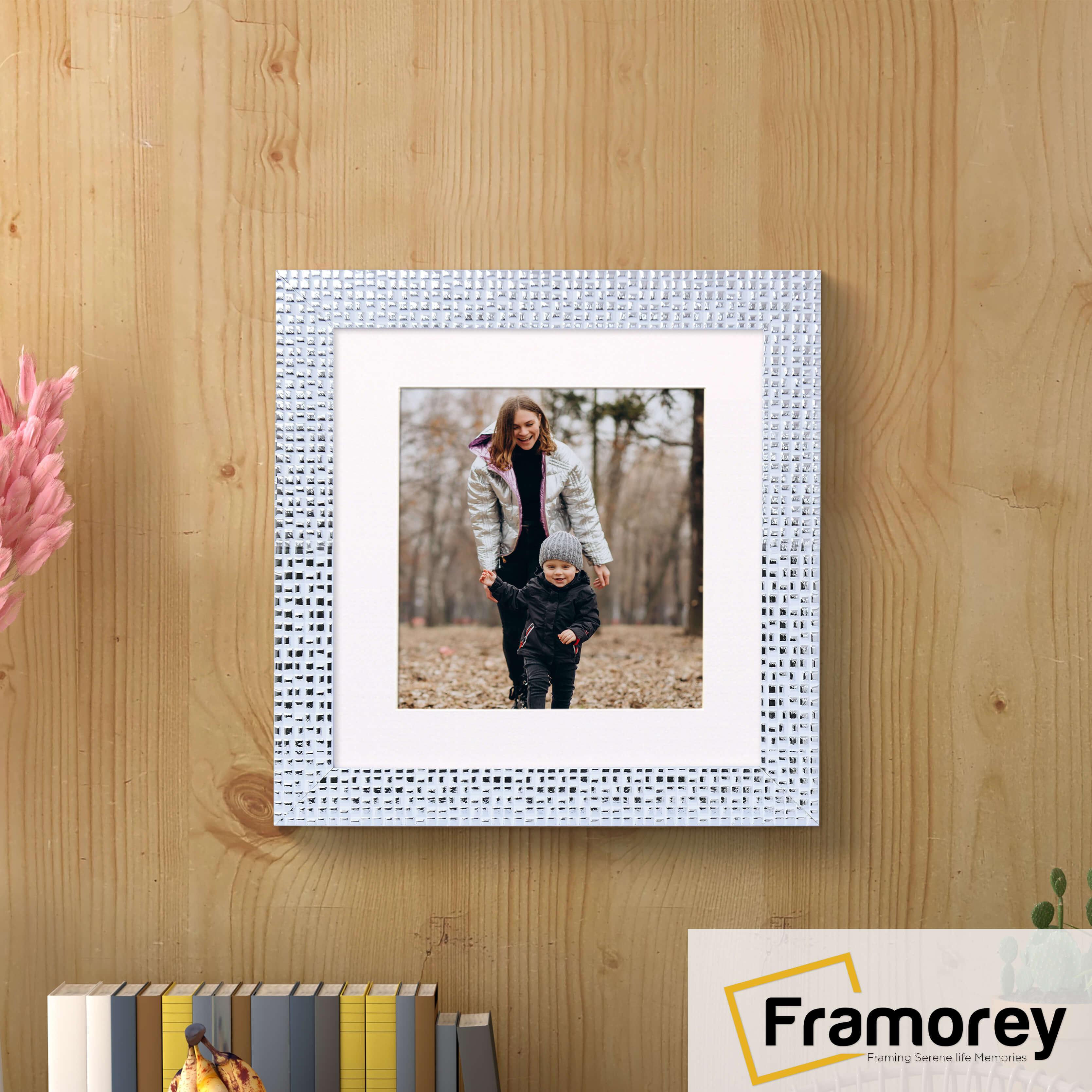 Square White Photo Frame Rockstar Style With White Mount hanging on a wooden wall.